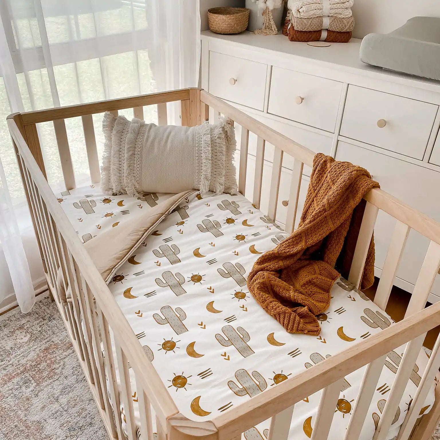 Cotton crib Quilt in the perfect size with the Arizona cactus print on it. Natural Breathable fabrics and wadding.