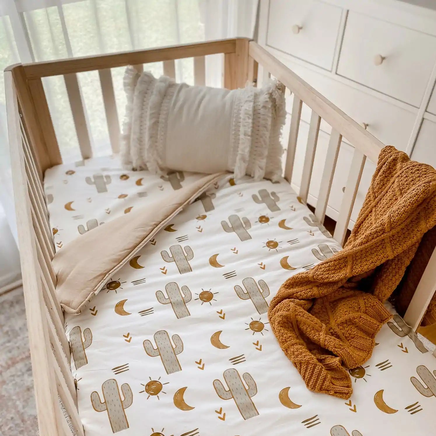 Neutral colors and prints on a cotton quilt, including a cotton knitted blanket perfect for cold weather and breathable layers Crib Size avaliable in Canada