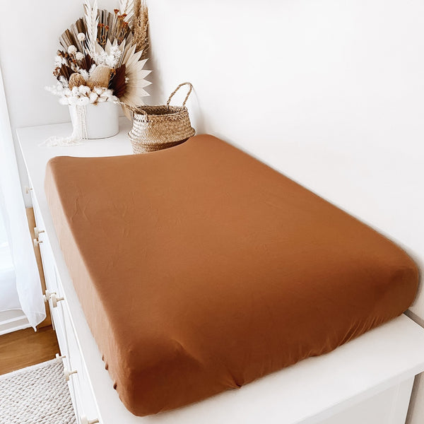 A beautiful cinnamon bassinet sheet for your baby's comfort.