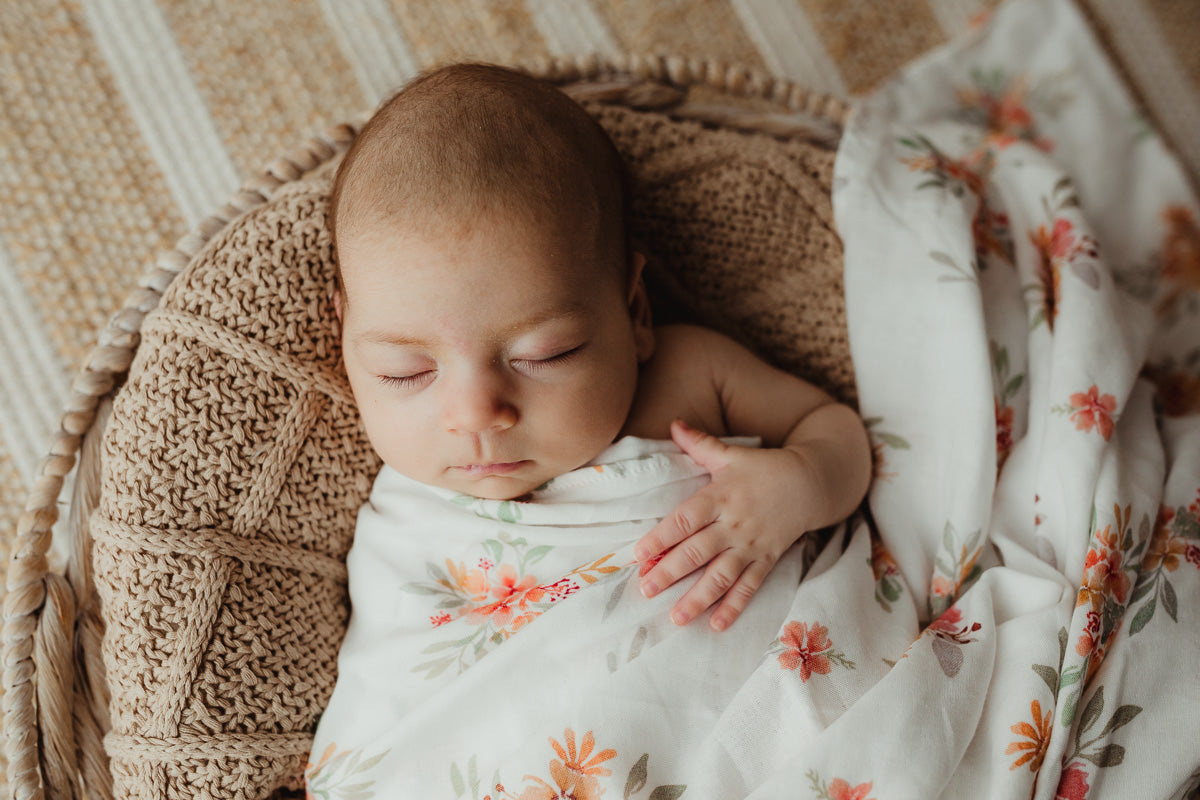 Pink floral print in a 100% cotton Muslin wrap making a baby's sleep perfect and peaceful. 