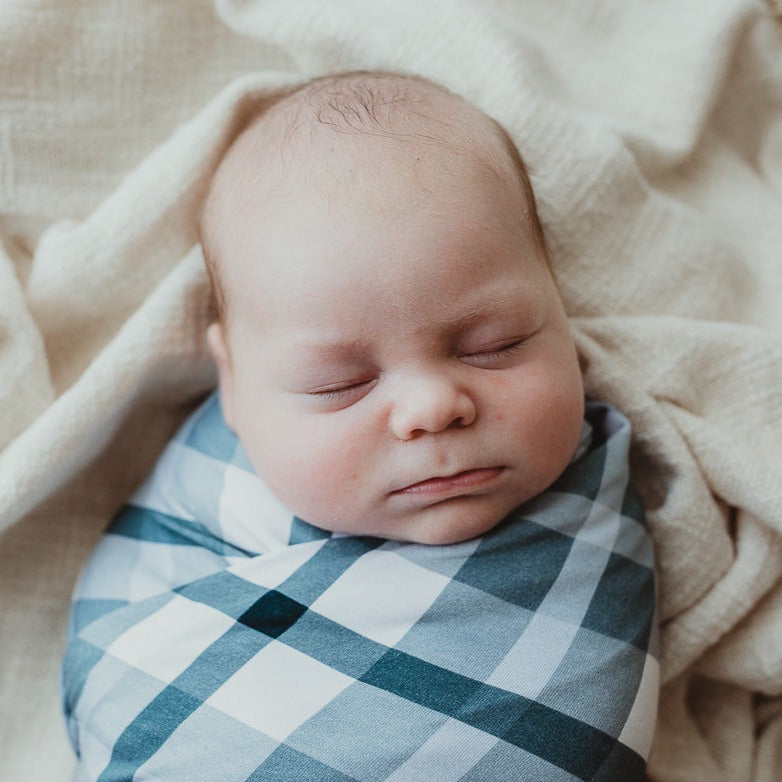 Close up of a baby all wrapped up in a jersey cotton blend stretch wrap from snuggly jacks canada