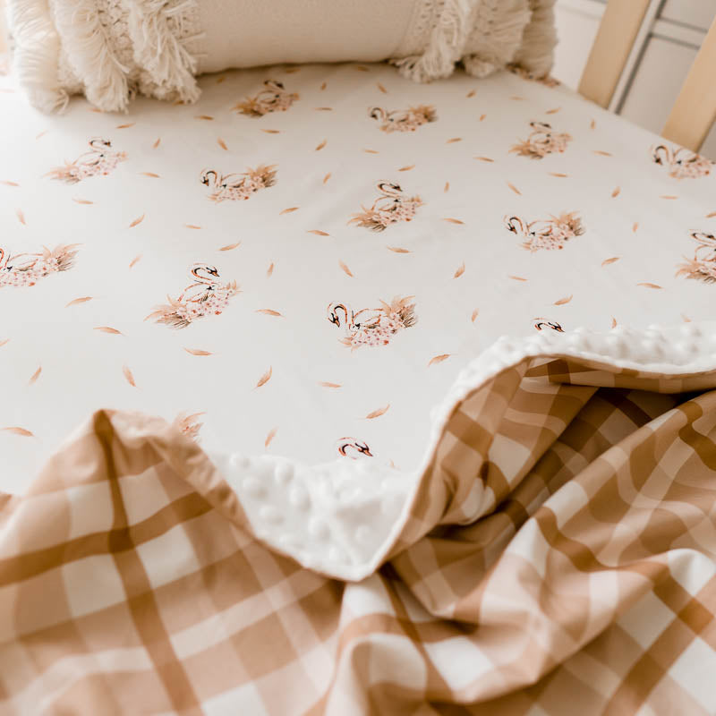 Tassled pillow, swan sheet, brown plaid dimple dot minky.